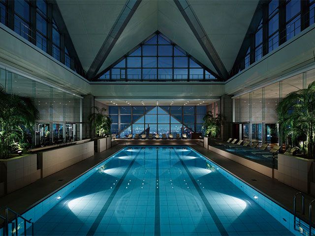 Swimming pool, Interior design, Glass, Ceiling, Majorelle blue, Lobby, Aqua, Houseplant, Interior design, Symmetry, 