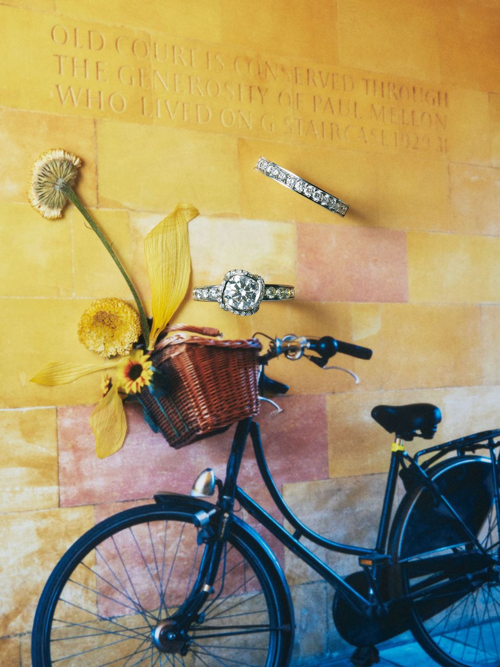 Bicycle, Yellow, Bicycle part, Bicycle wheel, Bicycle accessory, Vehicle, Wall, Bicycle handlebar, Bicycle saddle, Bicycle fork, 