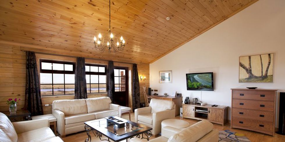 Living room, Room, Furniture, Property, Interior design, Building, Floor, Ceiling, Wood flooring, Home, 