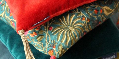 Textile, Costume accessory, Teal, Natural material, Cushion, Craft, Feather, Creative arts, 