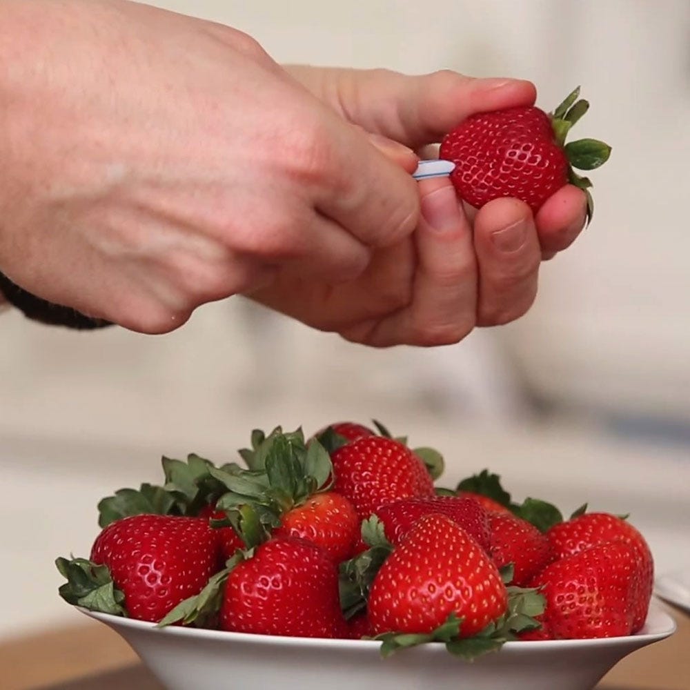 Watch The Strawberry Hack To Show You How To Remove The Stem Without Losing Half The Berry