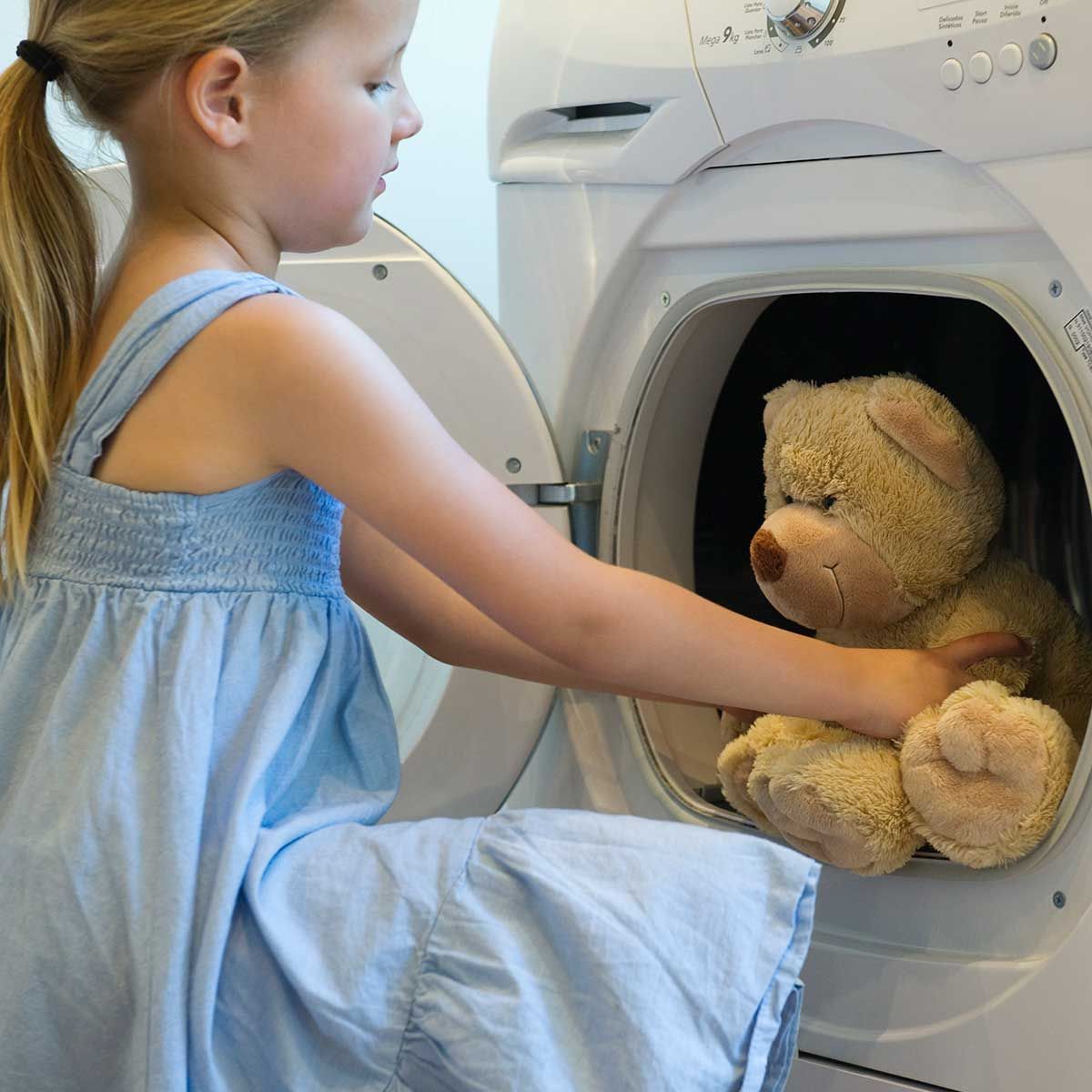washing teddy bear in washing machine