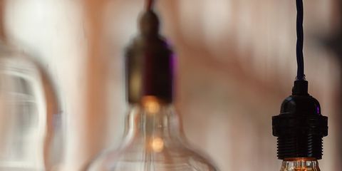 Lighting accessory, Amber, Light, Incandescent light bulb, Tints and shades, Reflection, Interior design, Light fixture, Electricity, Light bulb, 