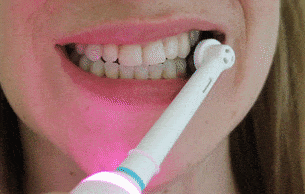 best way to brush teeth with electric brush