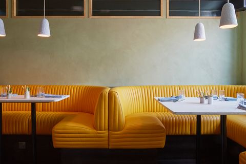 Restaurant, Room, Yellow, Lighting, Interior design, Wall, Table, Furniture, Design, Building, 