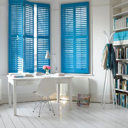Blue, Room, Interior design, Floor, Shelf, Bookcase, Furniture, Flooring, Wall, Window covering, 