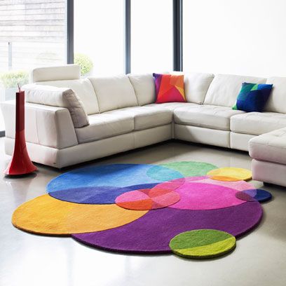 Interior design, Room, Wall, Couch, Living room, Furniture, Floor, Flooring, Colorfulness, Pillow, 
