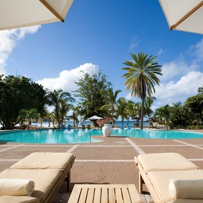 Swimming pool, Resort, Outdoor furniture, Real estate, Sunlounger, Aqua, Turquoise, Azure, Shade, Tropics, 