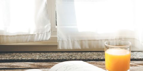 Yellow, Book, Morning, Text, Room, Publication, Table, Drink, Orange juice, 