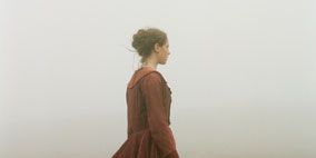 Clothing, Hairstyle, Sleeve, Human body, Photograph, Standing, Atmospheric phenomenon, Dress, Formal wear, People in nature, 