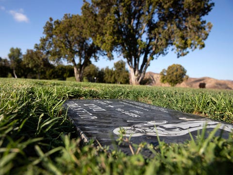 a black headstone marks the grave of juan peña diaz, an undocumented worker from mexico who was killed by anaheim police in 1953
