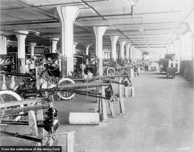 Before the advent of the moving assembly line, Ford and other automakers used variations of the station-build approach. Rather than the car coming to individual workers, a team of workers came to the car. Ford produced Model Ts in this manner for three years at its new Highland Park plant before adopting the assembly line.