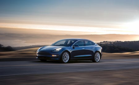 Stand and Deliver: Elon Musk Hands Off First Tesla Model 3 Production Cars