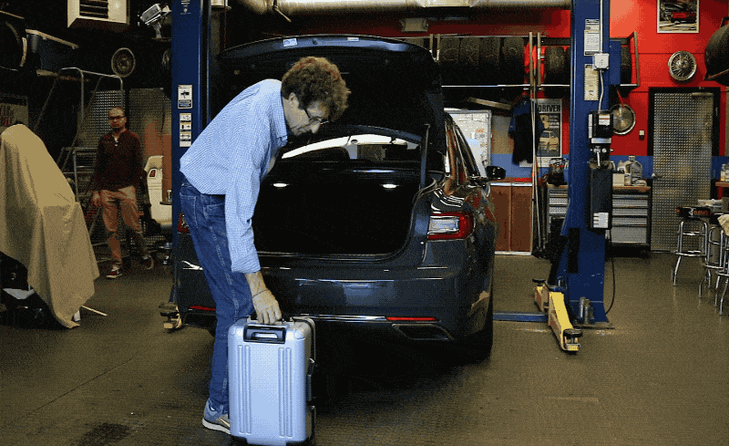 2017 Lincoln Continental Cargo E And Storage Review Car Our 6 Tester Loads A Standard Piece Of Carry On Luggage Into The Cargo Compartment To Demonstrate Lift Over Height Vehicle