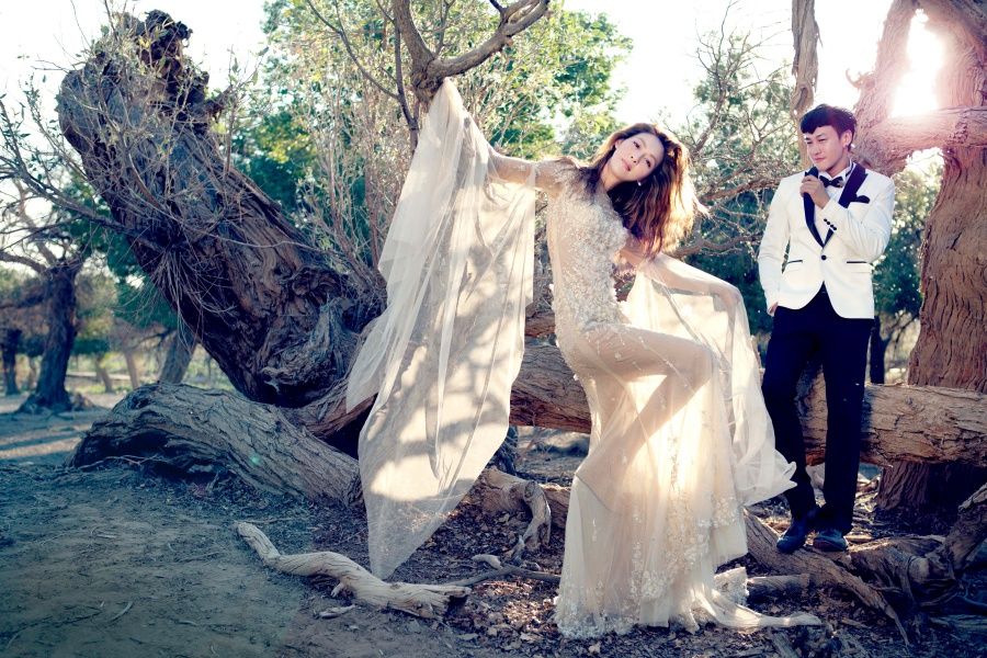 Trousers, Branch, Photograph, Coat, Outerwear, Dress, Wedding dress, People in nature, Bride, Bridal clothing, 