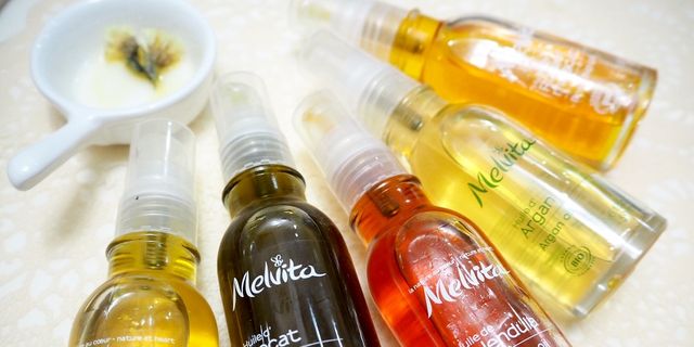 Liquid, Fluid, Product, Brown, Yellow, Bottle, Glass bottle, Amber, Orange, Bottle cap, 