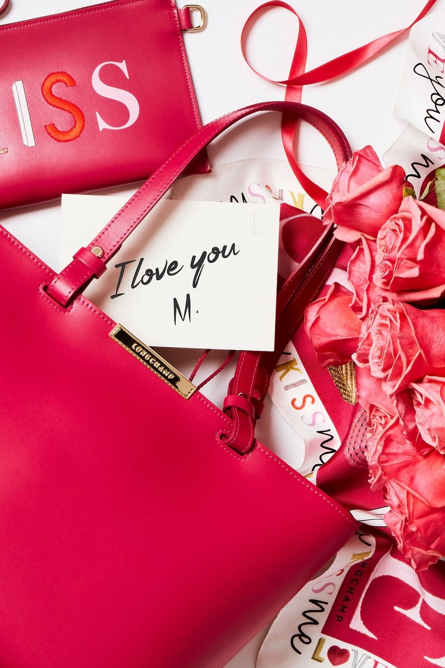Red, Ribbon, Font, Present, Bag, Shoulder bag, Party favor, Gift wrapping, Wedding favors, Valentine's day, 