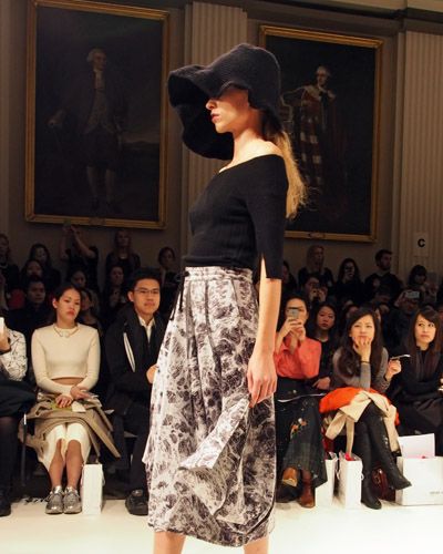 Clothing, Footwear, Event, Fashion show, Human body, Shoulder, Hat, Runway, Joint, Outerwear, 