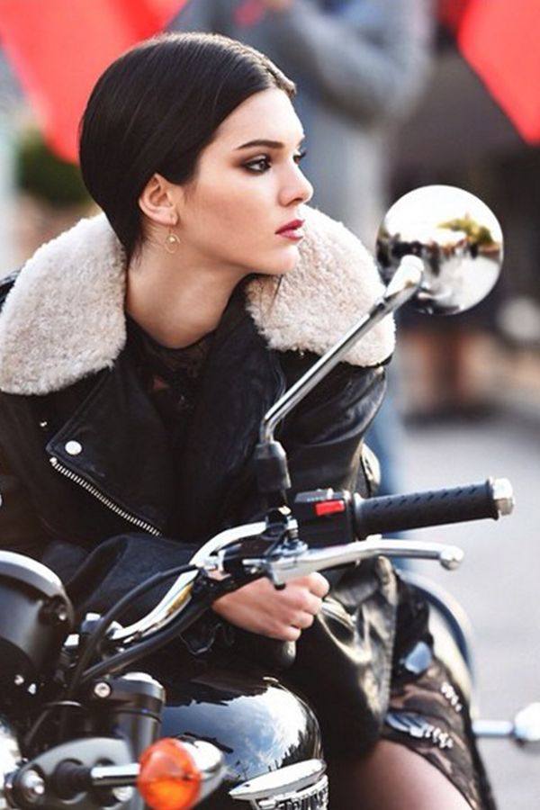 Nose, Mammal, Motorcycle, Jacket, Street fashion, Motorcycling, Long hair, Leather, Leather jacket, Eye liner, 