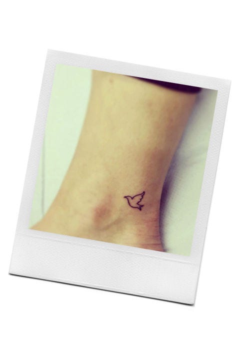 Skin, Joint, Tan, Ankle, Body jewelry, Symbol, Flesh, Tattoo, Temporary tattoo, 