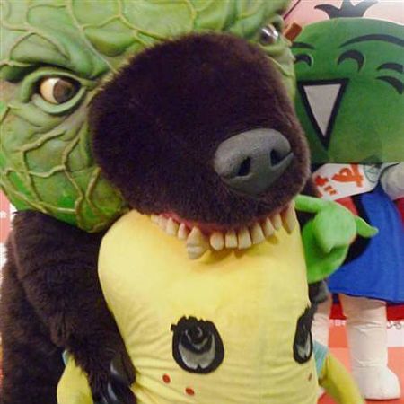Green, Textile, Toy, Plush, Mascot, Fictional character, Stuffed toy, Fur, Costume, Baby toys, 