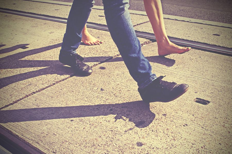 Leg, Shoe, Human leg, Road surface, Shadow, Street fashion, Calf, Tints and shades, Foot, Walking, 