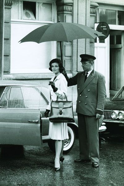 Vehicle, Automotive design, Trousers, Umbrella, Photograph, Standing, White, Car, Style, Coat, 
