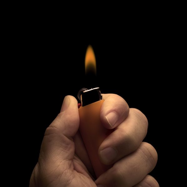 Finger, Thumb, Nail, Gesture, Smoking accessory, Gadget, Lighter, Fire, Flame, 