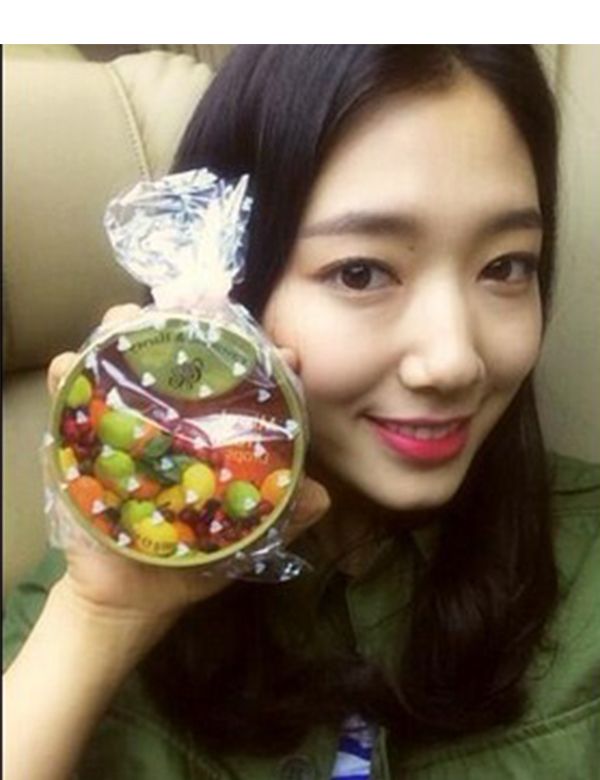 Iris, Black hair, Selfie, Candy, Sweetness, Confectionery, Long hair, Hard candy, Ornament, Ball, 