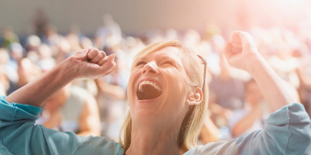 Facial expression, People, Cheering, Happy, Arm, Fun, Crowd, Hand, Finger, Gesture, 