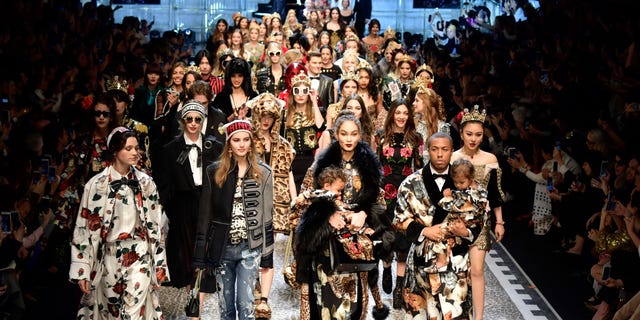 Crowd, Audience, Fashion, Street fashion, Public event, Fashion model, Fur, Fashion design, Runway, Costume design, 