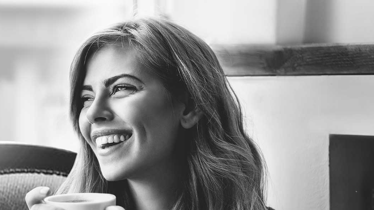 Hairstyle, Cup, Eyebrow, Coffee cup, Happy, Facial expression, Style, Jaw, Tooth, Tableware, 
