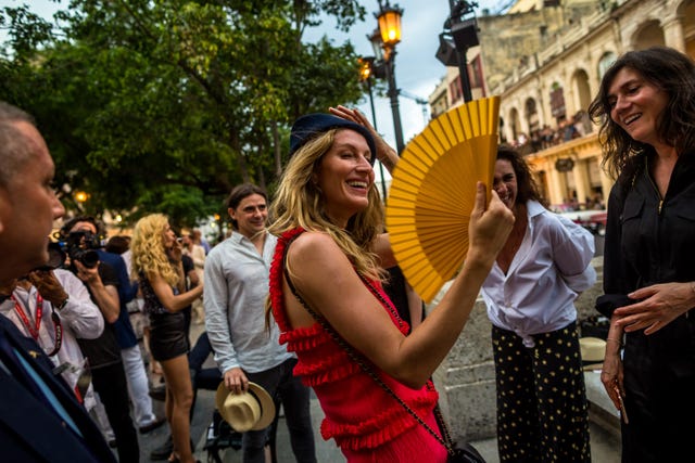 Smile, People, Street light, Crowd, Luggage and bags, Tradition, Street performance, Drum, Flag, Traffic light, 