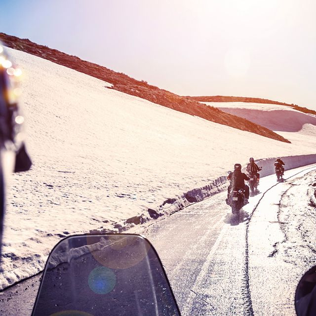 Group of bikers on snowy road, active lifestyle, adventure trip, extreme  moto sport, off-road transport, race competition, speed concept