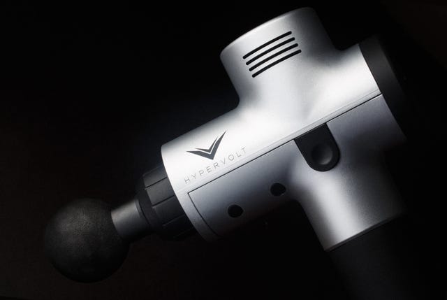 a close up of a percussion massage gun