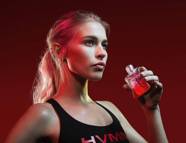 a blonde woman holding a bottle of ketones