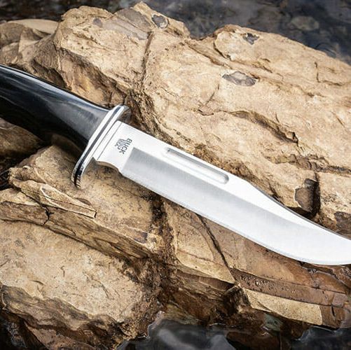 a large knife on a rock