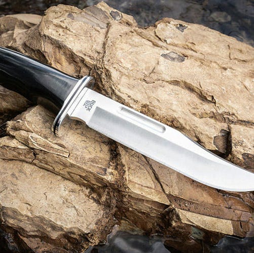 best bushcraft knives a large knife on a rock