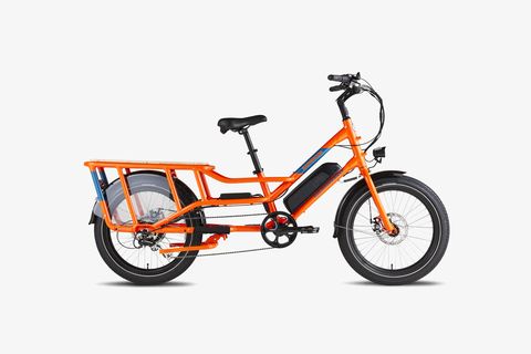 an orange e bike with a bench above the rear wheel