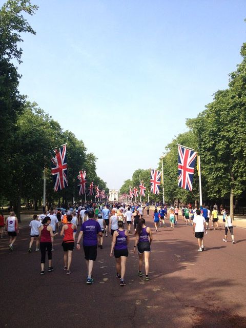 Clothing, Crowd, Flag, Pole, Pedestrian, Endurance sports, Walking, Active shorts, Tourist attraction, Running, 
