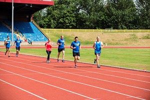 Grass, Sport venue, Track and field athletics, Race track, Public space, Athletic shoe, Line, Running, Endurance sports, Shorts, 