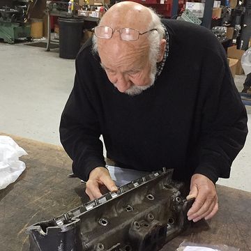 Jack Maurer at Automotive Machine inspects Project TR7s cylinder head.