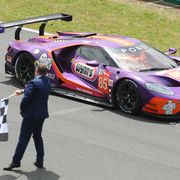 The No. 85 Ford GT takes the checkered flag at Le Mans on Sunday.
