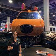 Linsey Read poses in front of her 2020 Monster Jam Monster Truck competitor on display at the 2019 SEMA&nbsp;Show.
