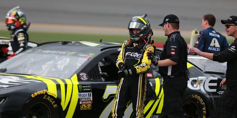 Justin Haley <span id="CT_Main_1_cache_lblCaption">walks away from his car during a weather delay for the Coke Zero Sugar 400 at Daytona</span> International Speedway.
