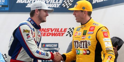Todd Gilliland shakes hands with team owner Kyle Busch following their victory in the NASCAR Hall of Fame 200.
