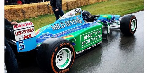 Damon Hill prepares to take the 1994 Benetton for a spin at the Goodwood Festival of Speed.
