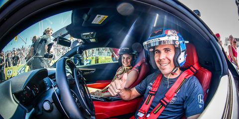 <span class="child">Robert Wickens behind the wheel of a custom Acura NSX with his fiance Karli Wo</span>ods.
