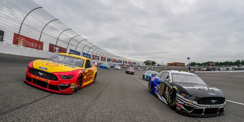 Cars took to the Michigan International Speedway for parade laps before they were parked for the day on Sunday in Brooklyn, Michigan.
