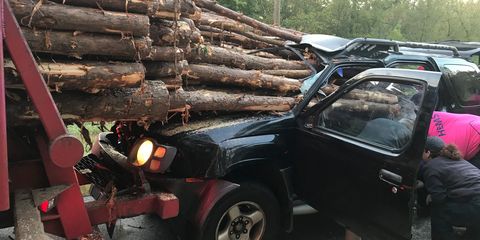 This Nissan Xterra was impaled by logs from a log truck in Georgia.
